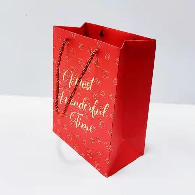 China Recycled Materials Fashion Gift Paper Bag Packaging Clothing Shoes Shopping Mall Gift Cosmetics Packaging Handbag Party Bag for sale