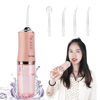 China Portable To Use 4 Rotating Nozzles Portable Oral Irrigator Water Flosser Electric Oral Irrigator With Removable 220ML Water Tank for sale