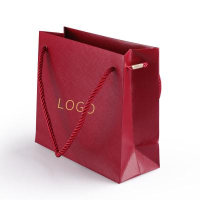 China Luxury Red Recycled Materials Shopping Bags Custom Paper Logo Printed Foldable Reusable Paper Shopping Bags for sale