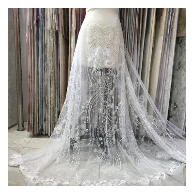 China 2021 Viable New White Wedding Dress Fashion Customized Color Elastic Custom Pattern Beaded Lace Fabric for sale