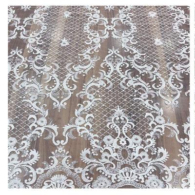 China Viable Most Popular Gold African Wedding Lace Fabric For Bridal Sequin Beaded Tulle Lace Embroidered Flower Applique For Dress for sale