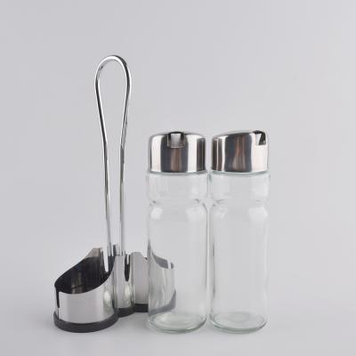 China Viable Kitchen Accessories Hot Selling Amazon Oil Dispenser Glass Bottle With Base Restaurant Condiment Bottle Set for sale