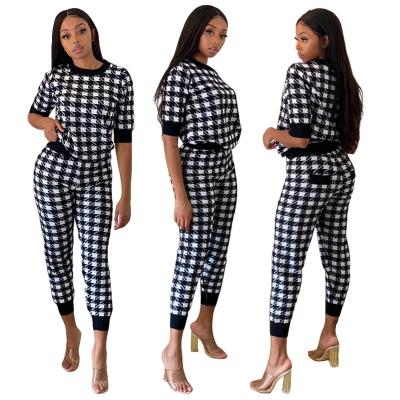 China 2021 Wholesale Breathable Black And White Plaid Sports Two Piece Printed Tights Suit Women's Fall Sets for sale