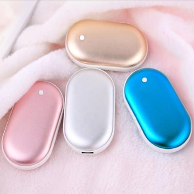 China Lovely cute 3600 mAh hand warmer power bank mini hand plug charging portable multifunctional power bank for sale