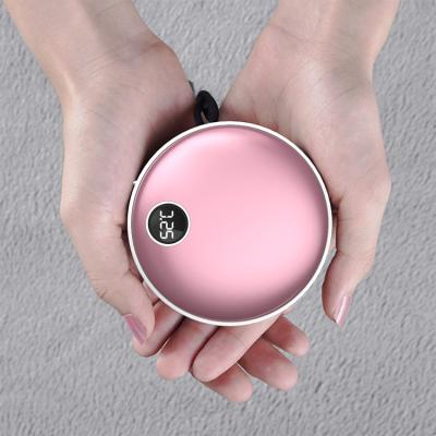 China Lovely cute 5000 mAh hand warmer power supply mini hand plug charging portable multifunctional power bank for sale