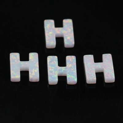 China 26 Color Change Fire Opal Letter H Fashion Shape Synthetic Opal For Jewelry for sale