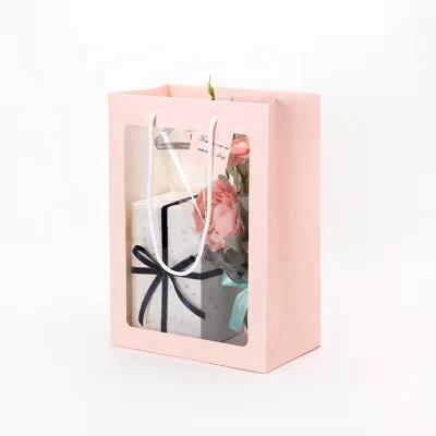 China Recyclable Custom Gift Flower Paper Bag Fashion Kraft Paper Bag With Clear PVC Window for sale