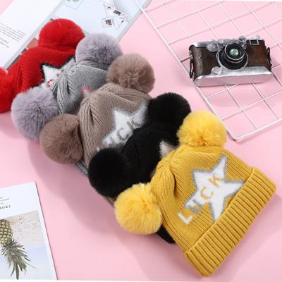 China JOINT Wholesale Warm Kids Winter Cute Lucky Star Cute Windproof Knitted Beanie Hat With 2 Pom Pom for sale