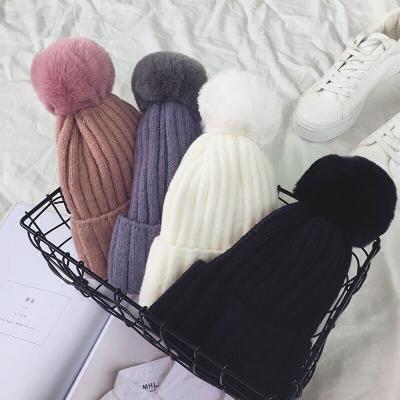 China JOINT Wholesale Custom Logo Winter Hat Knitted Beanie With Pom Pom for sale