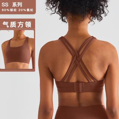 China 2022 High Print Yoga Bra Women's Workout Wear Cross Backless Breathable Push Up Adjustable Sports Bra for sale