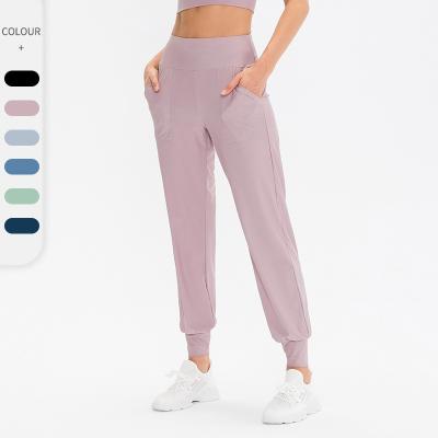 China Wicking Breathable Quick Sweat Slim Sport Wears Gym Running Yoga Pants Phones Pocket Jogger Sporty Pants for sale