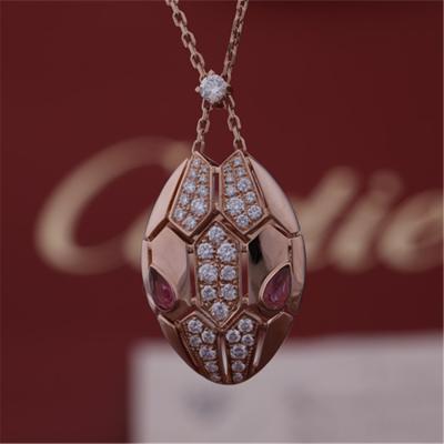 Cina La collana di Roman Serpenti in 18 kt è aumentato oro messo con gli occhi del rubellite e con i diamanti del pavé sulla testa in vendita