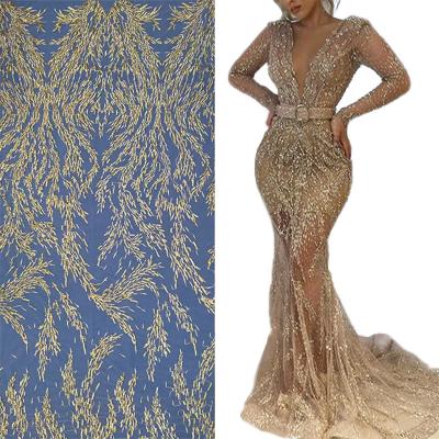 China Modern Luxury White Bridal Gown Fabric Evening Blaze Mesh Soft Embroidery Bead Tulle Breathable Lace Gold Wedding Dress for sale