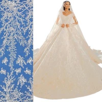 China Handmade Custom Colors and Patterns Elegant Sequined Beaded Tulle Embroidered Lace Fabric Bridal Wedding Dress for sale