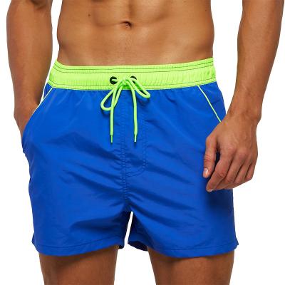 China Breathable Back Zipper Pockets Board Shorts Solid Quick-Drying Waterproof Surfing Swimming Trunks With Men for sale