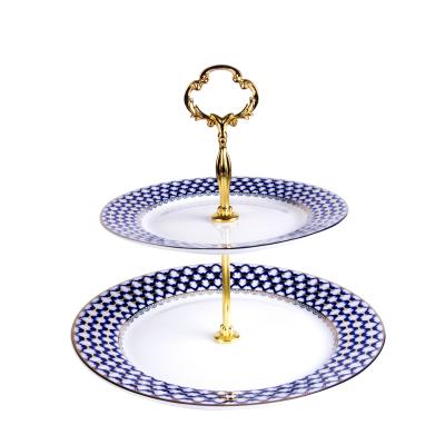 China Sustainable 2 Tier Porcelain In-Gloss Cake Stand With Gold Handle Gold Lid for sale