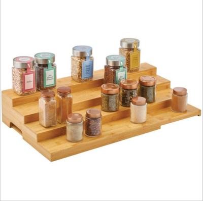 China 4 Layer Sustainable Natural Bamboo Expanding Display Stand with Handle Kitchen Spice Rack Cabinet Organizer for sale