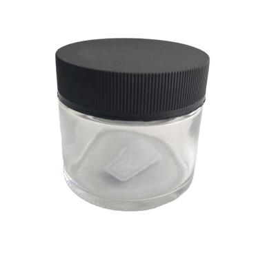 China Food Cosmetics Skin Care Cream Jar Storage Bottles 4oz Flat Clear Round Glass With Black Lid for sale