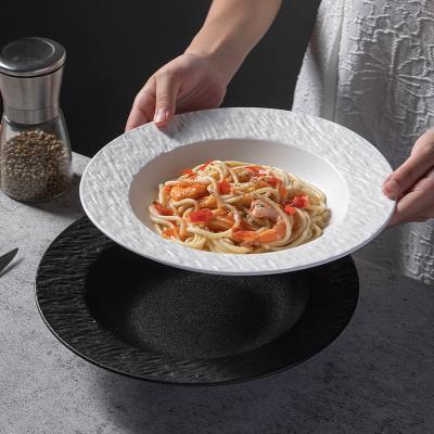 China Durable High End Japanese Black And White Stone Gritty Round Stone Dish Household Ceramic Dish Western Food for sale