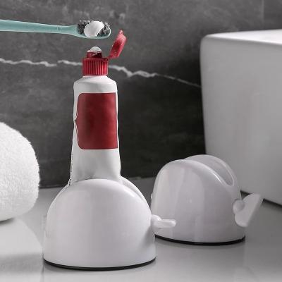 China Creative Bathroom Cream Toothpaste Dispenser Squeeze 1pcs Squeeze Squeezer Tube Viable Rolling Accessory Set for sale