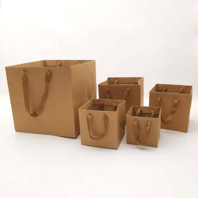 China Recyclable Recyclable Kraft Paper Bags With Printed Handle In Different Colors And Sizes Customized Wholesale for sale