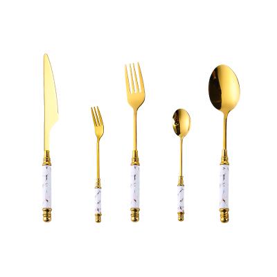 China Sustainable Nordic Style Flatware Sets Handle Flatware Set Gold Colored Ceramic Cutlery With Rack for sale