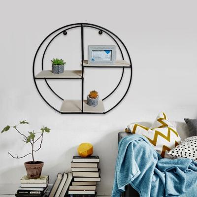 China Black Creative Metal Adjustable Creative Metal Bedroom Living Room Round Wall Shelf Round Chinese Style Wall Mounted Storage (Height) Rack for sale