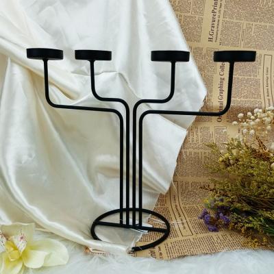 China Luxury European Black Morden Metal Home Party Decoration Candlestick Wedding Decor Table Candlestick for sale