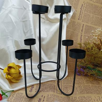 China Luxury Morden Vintage Black Metal Irregular Shape Candlestick Dinner Table Candlestick For Home Decoration for sale