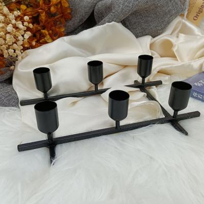 China Morden Handcraft Luxury Vintage Black Metal Craft Candlestick Wedding Decoration 4 Head Candlestick Holder for sale