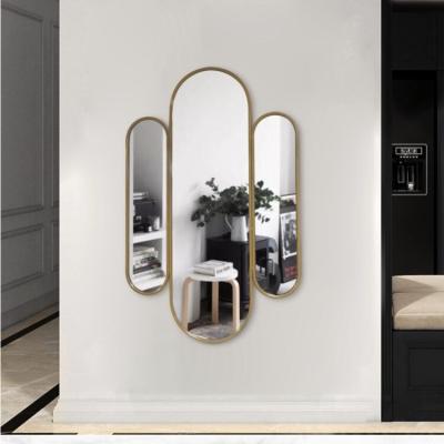 China Home Style Metal Frame Modern Wall Mirror Unique Irregular Gold Wall Mirror for sale