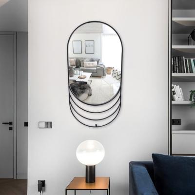 China Modern Unique Ellipse Wall Mirror Black Metal Framed Wall Mirror Living Room Stone Frame Wall Mirror for sale