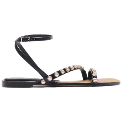 Κίνα Pearl 2021 European Roman open toe summer new flat black sandals leather American handmade fashion women's pearl shoes προς πώληση