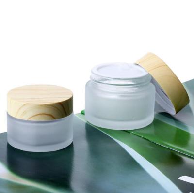 China Personal Care Cream Bottles Round Cosmetic Jars Hand Face Packaging Bottle Jars 5g 10g 15g 30g 50g 100g Cream Frosted Glass With Wood Grain for sale