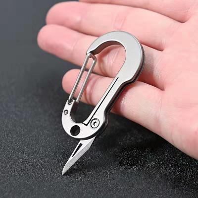 China Lightweight and Fast Folding Titanium Quick Change Knife Key Chain Delivery Box Cutter Alloy Key Hand Opener for sale