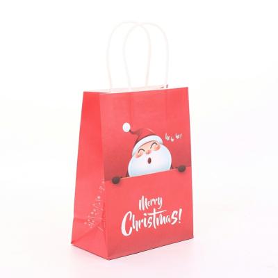 China Biodegradable Luxury Colorful Wholesale Christmas Kraft Paper Christmas Gift Wrapping Paper Bags With Handle for sale