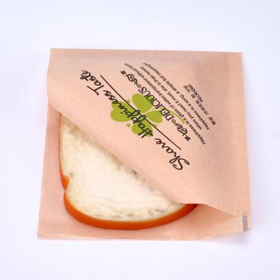 China Greaseproof Pastry Burger Laminated Food Wrapping Paper Take Away Sandwich Packaging Paper Bags n Triangle Shape for sale