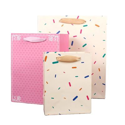 China Recyclable Wholesale Luxury Custom Paper Bag Gift Art Paper Bags With Ribbon Packaging Making Shopping Handles for sale