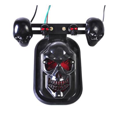 China Motorcycle Parts Black Skull Brake Tail Light with Turn Signal 1 Pair Turn Light for sale