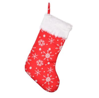 China Christamas Home Decoration Embroidered Red Snowflake Christmas Stockings Christmas Stockings With White Raw Edges for sale