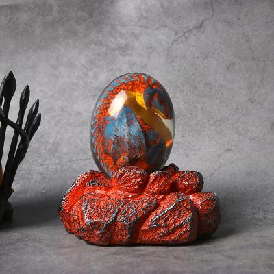 China Ornamental Artificial Handmade Transparent Dinosaur Egg Toy Clear Crystal Resin Lava Dragon Egg for Room Decorations for sale