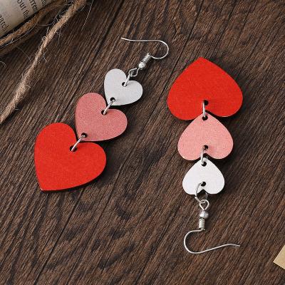 China New Valentine's Day Heart Shape Handmade Ramp Gradient Lovely Red Wooden Earrings for sale