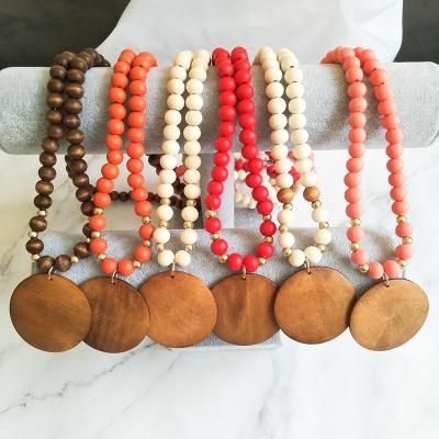 China TRENDY Custom Wooden Multicolor Disc Necklace Wooden Bead Solid Color Alphabet Pending Necklaces White Long for sale