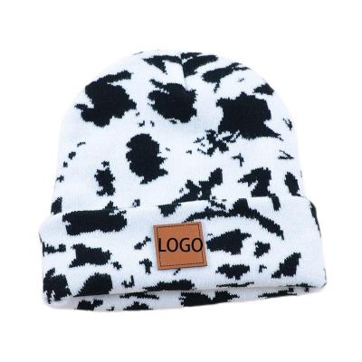 China New Arrival Fashion JOINT Leopard Cow Print Knitted Acrylic Female Beanie Hats Winter Warm Cap for sale