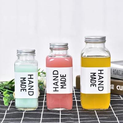 China Custom Clear Glass Square Empty Beverage Squeezer Milk Tea Coffee Soda Beverage Bottle 250ml 350ml 500ml for sale