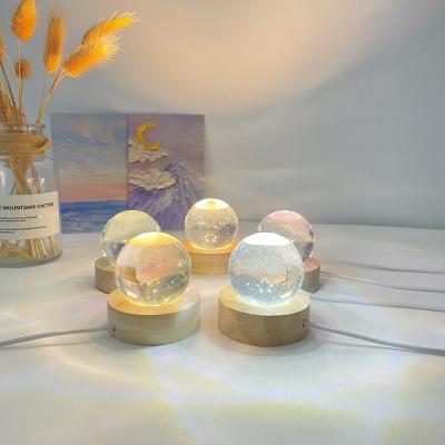 China Modern Wholesale Round Luminescence Round Crystal Ball Lamp Wooden Decorative Wood Base for sale