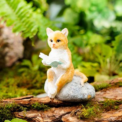 China Miniature Resin Home Deocration Kitten Reading on Stone Statue Mini Cat Figure Ornament for sale