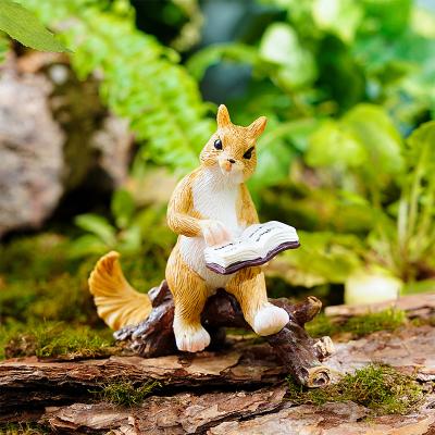 China Handcrafted Polyresin Book Squirrel on a Miniature Log Figurine for sale