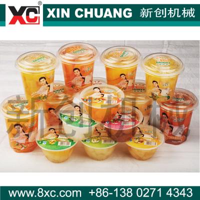 China Full Automatic Beverage Cup Fruit Salad Plastic Wrapping Machinery for sale