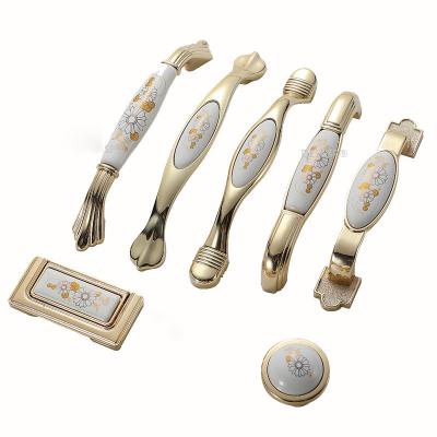 China New Modern Gold Door Zinc Alloy Ceramic Wardrobe Pulls European Antique Cupboard Knobs Flower Cabinet Fashion Drawer Hardware Handle for sale